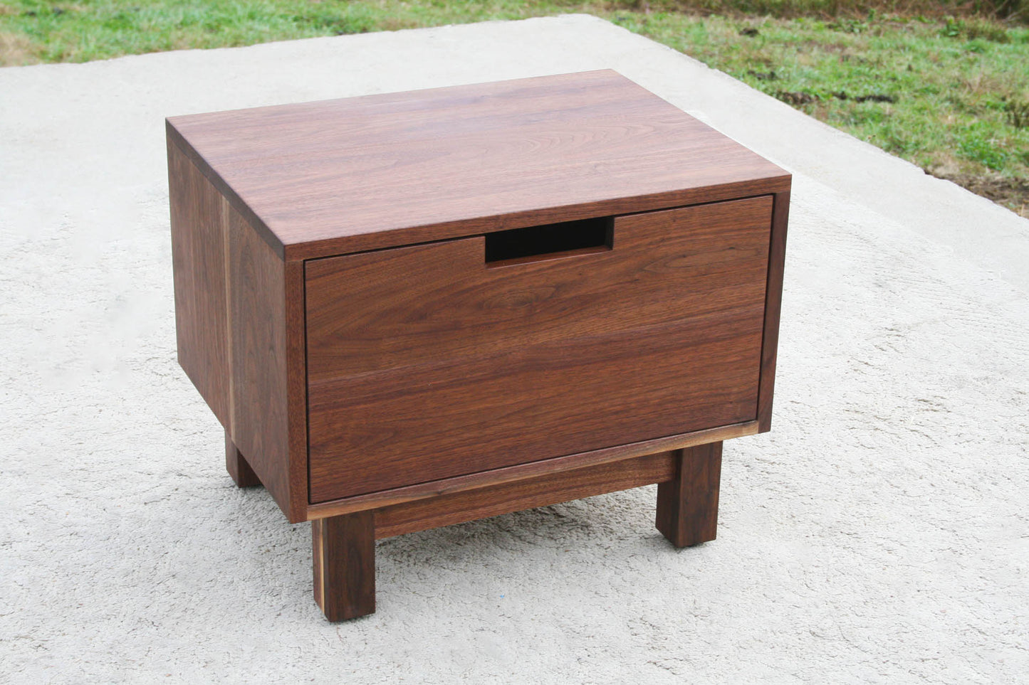 Low bedside table with one inset drawer top angled view
