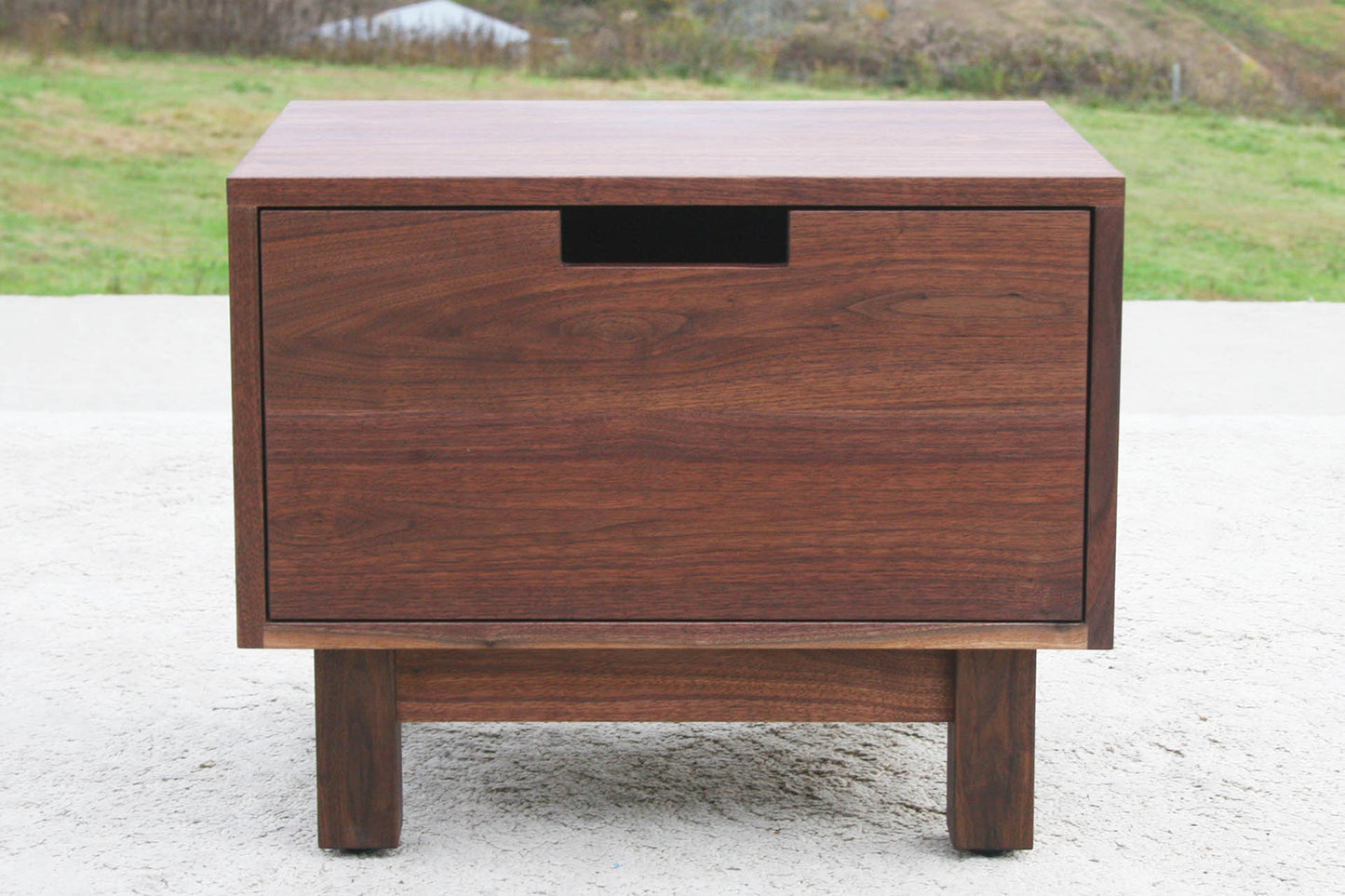 Low bedside table with one inset drawer front view