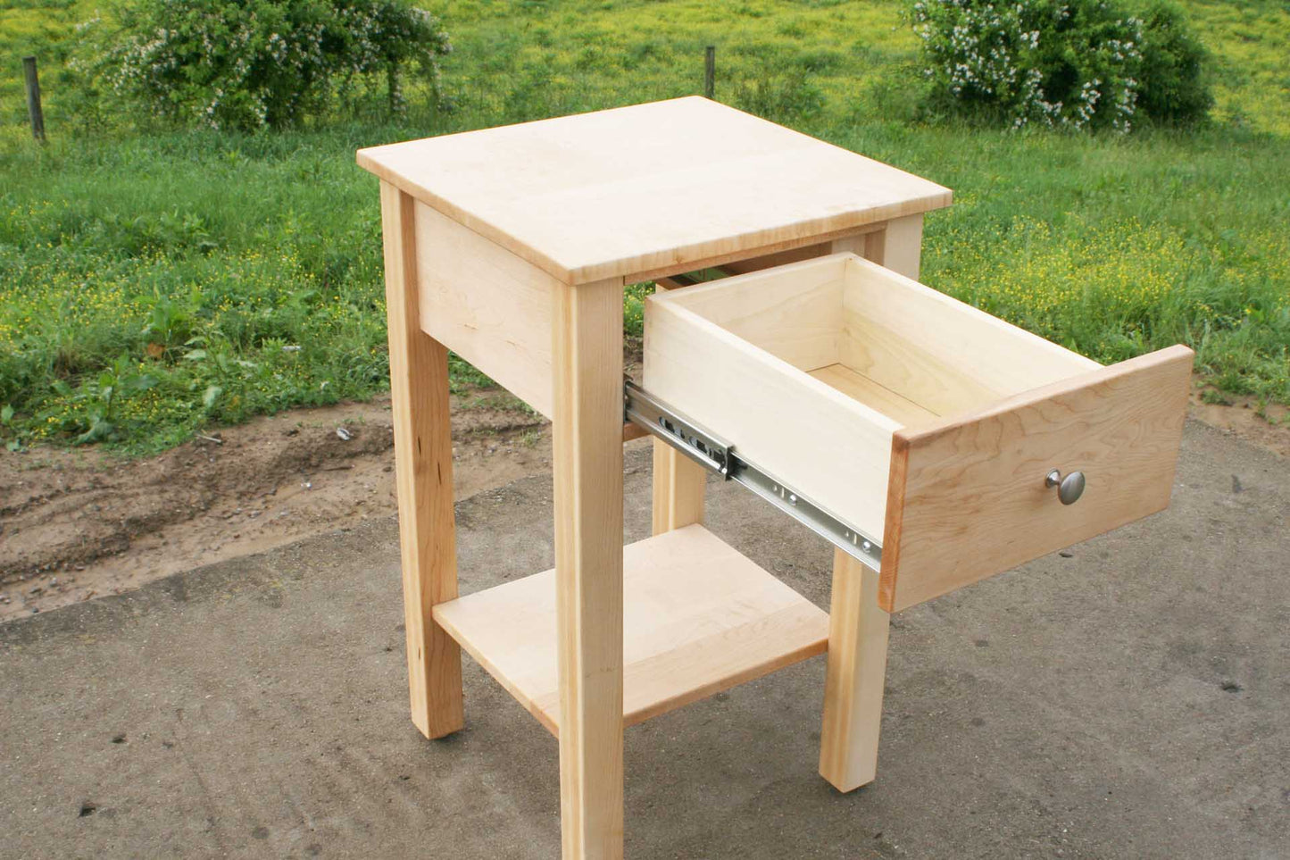 drawer open of nightstand with secret storage compartment