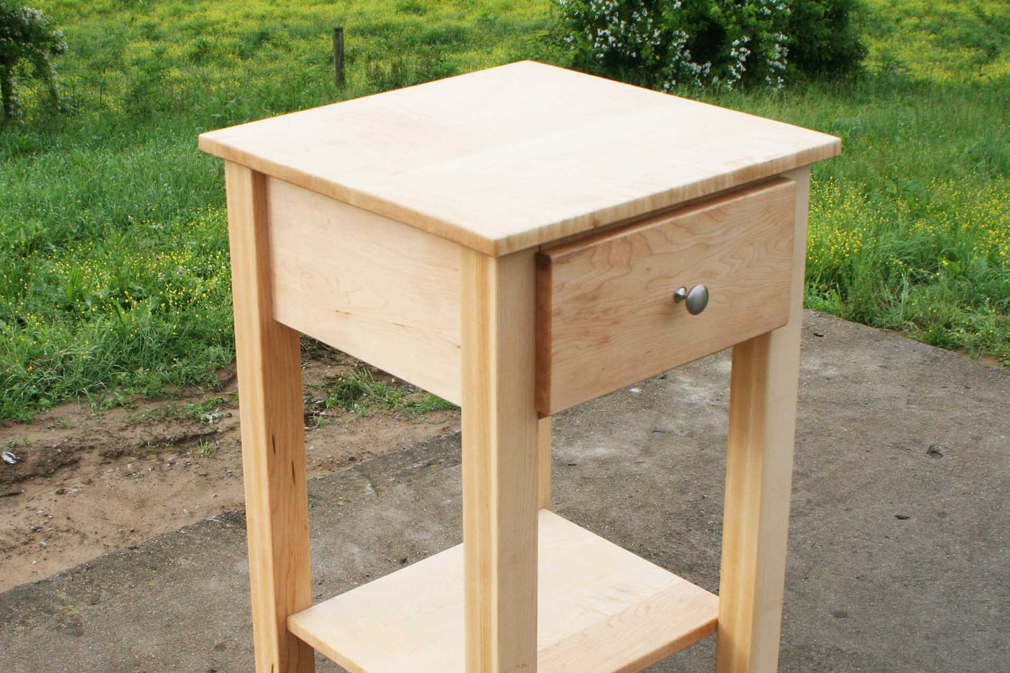 angled view nightstand with secret storage compartment