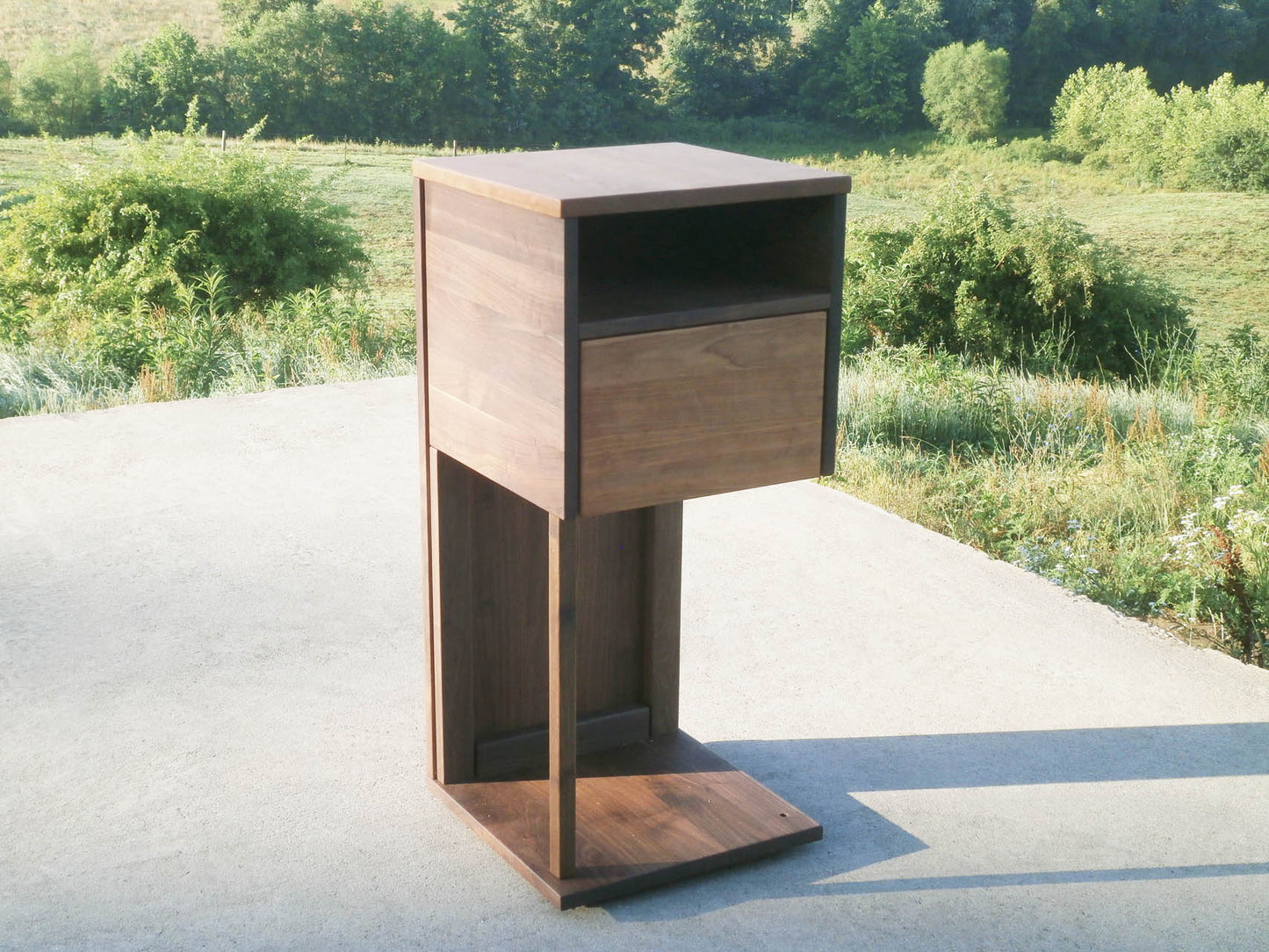 Overhanging table with drawer, shelf and support bar alternate angled view