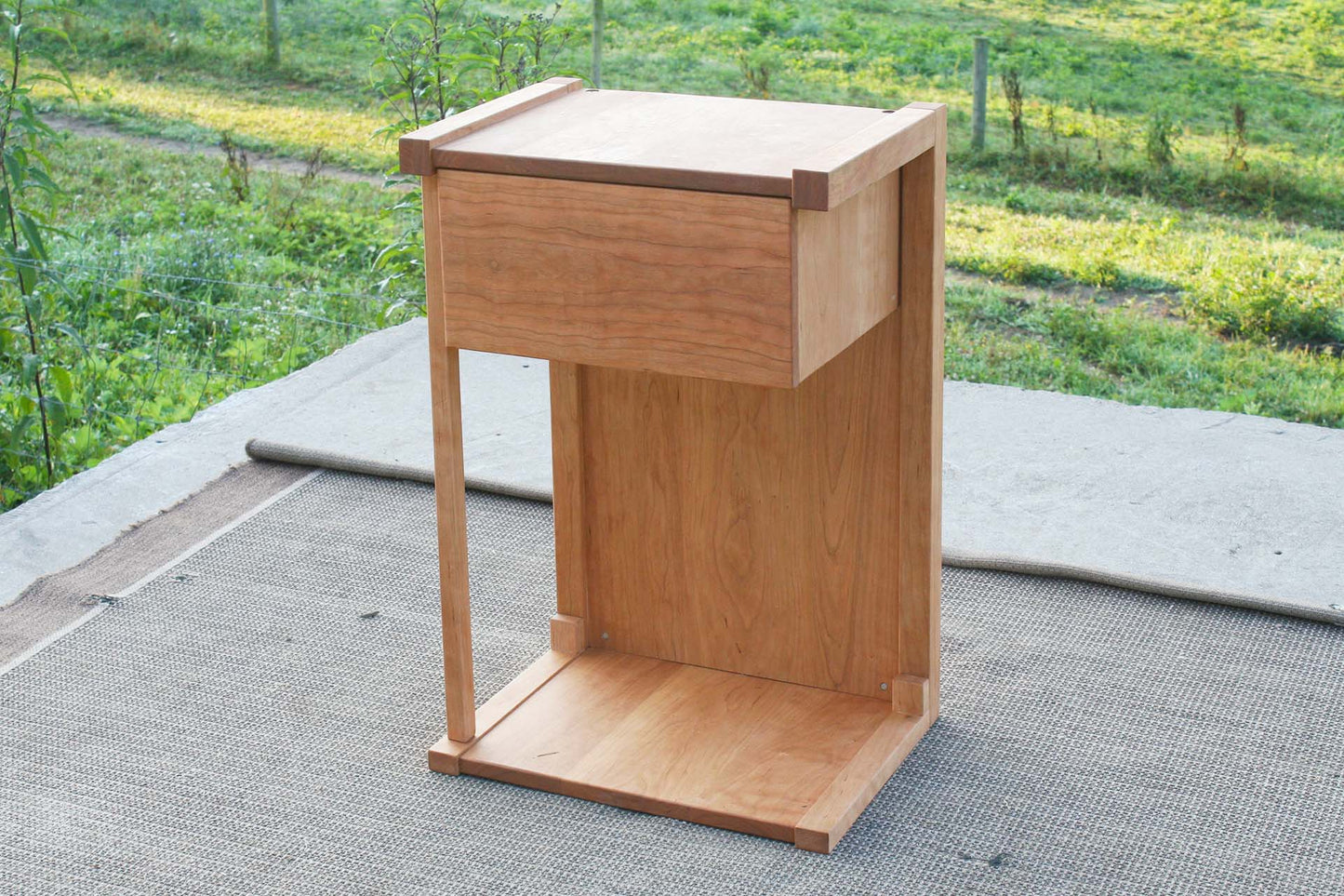 angled view solid hardwood Pass-Through Bedside Table with 1 Drawer