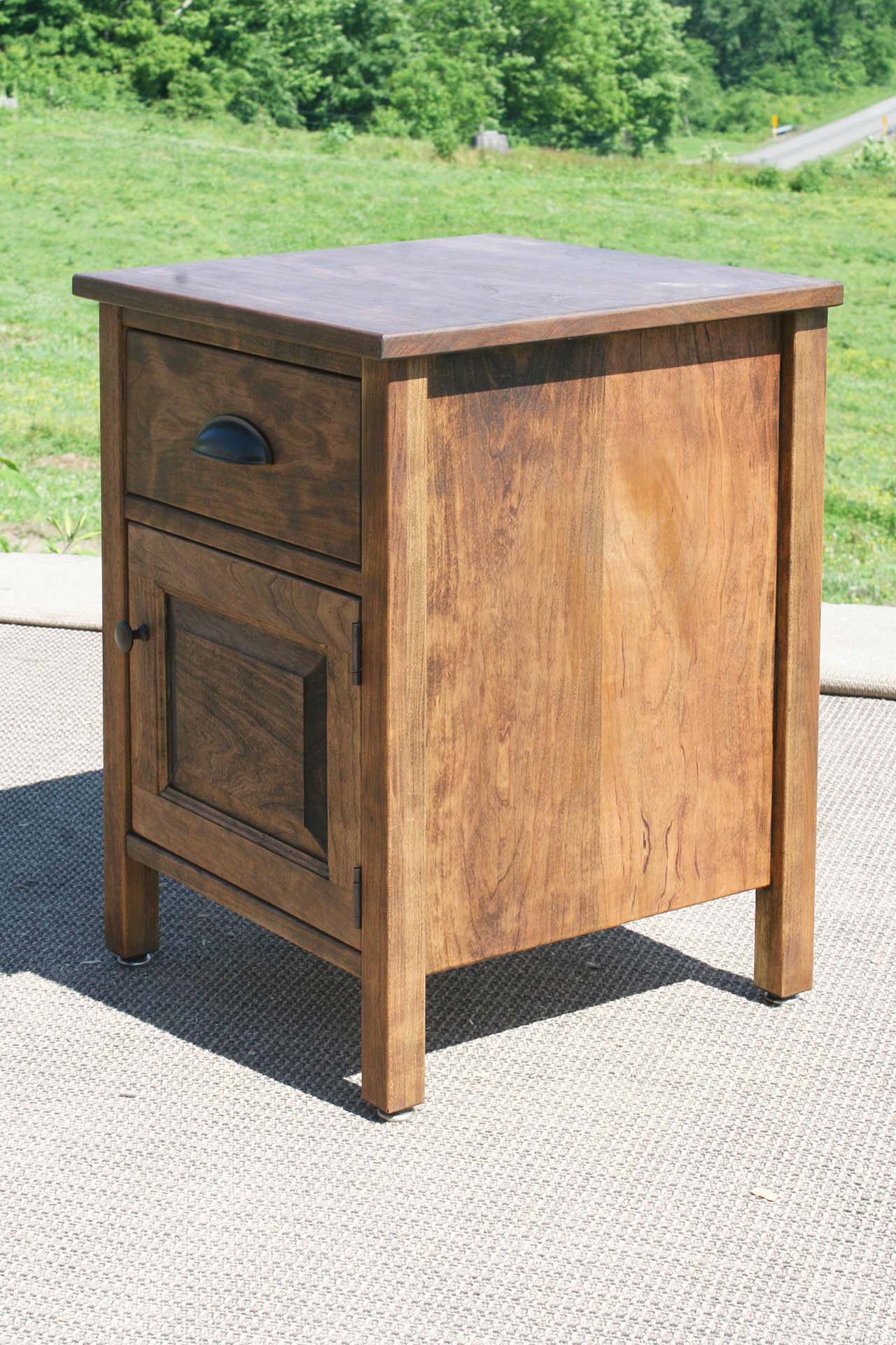 angled view dark wood bedside cabinet natural