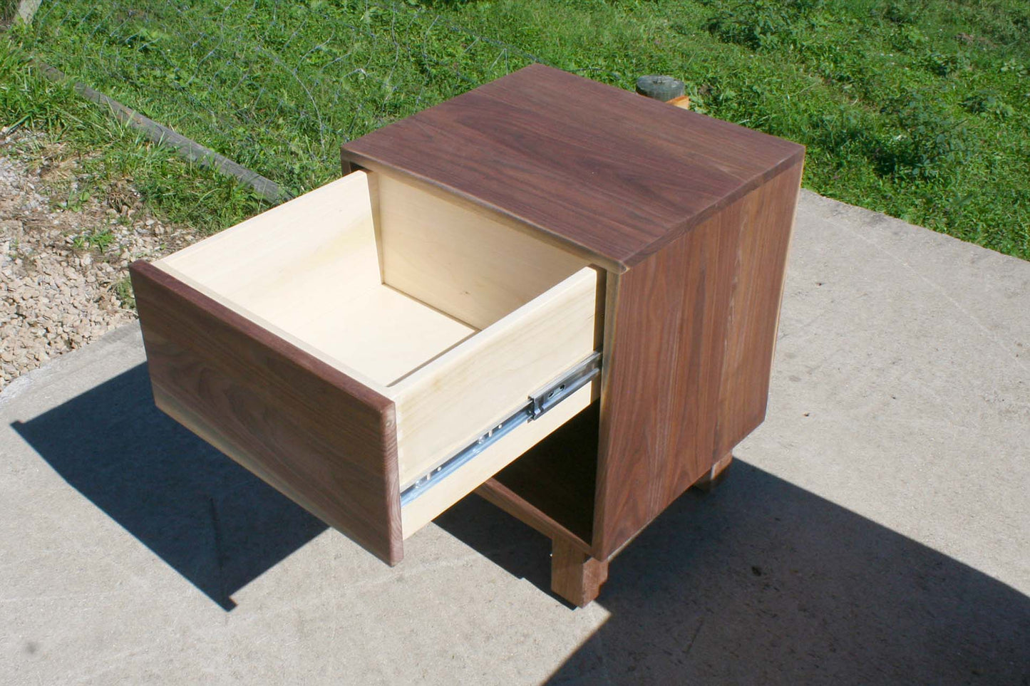 small walnut nightstand with drawer open