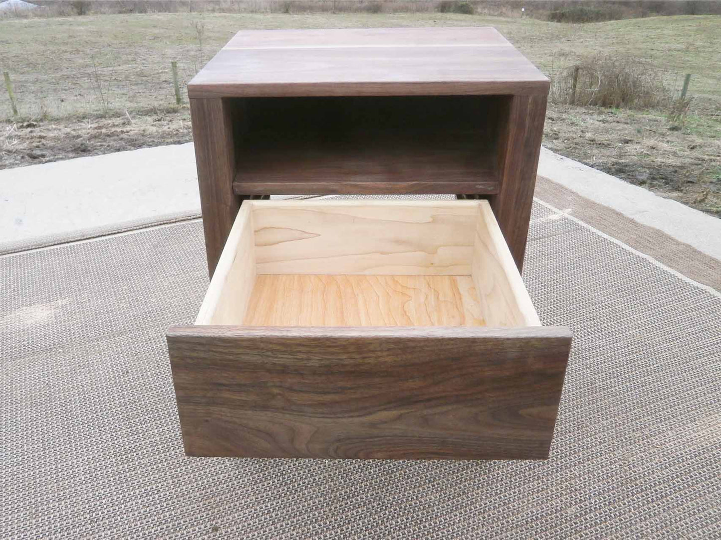 front view Bedside Table with 1 opened Inset Drawer and 1 Shelf