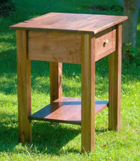 angled view solid custom bedside table walnut wood natural