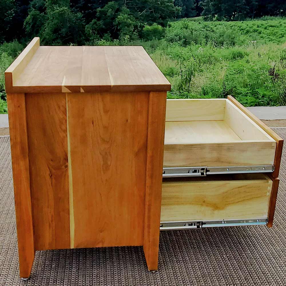 small dresser side view drawers open natural hardwood