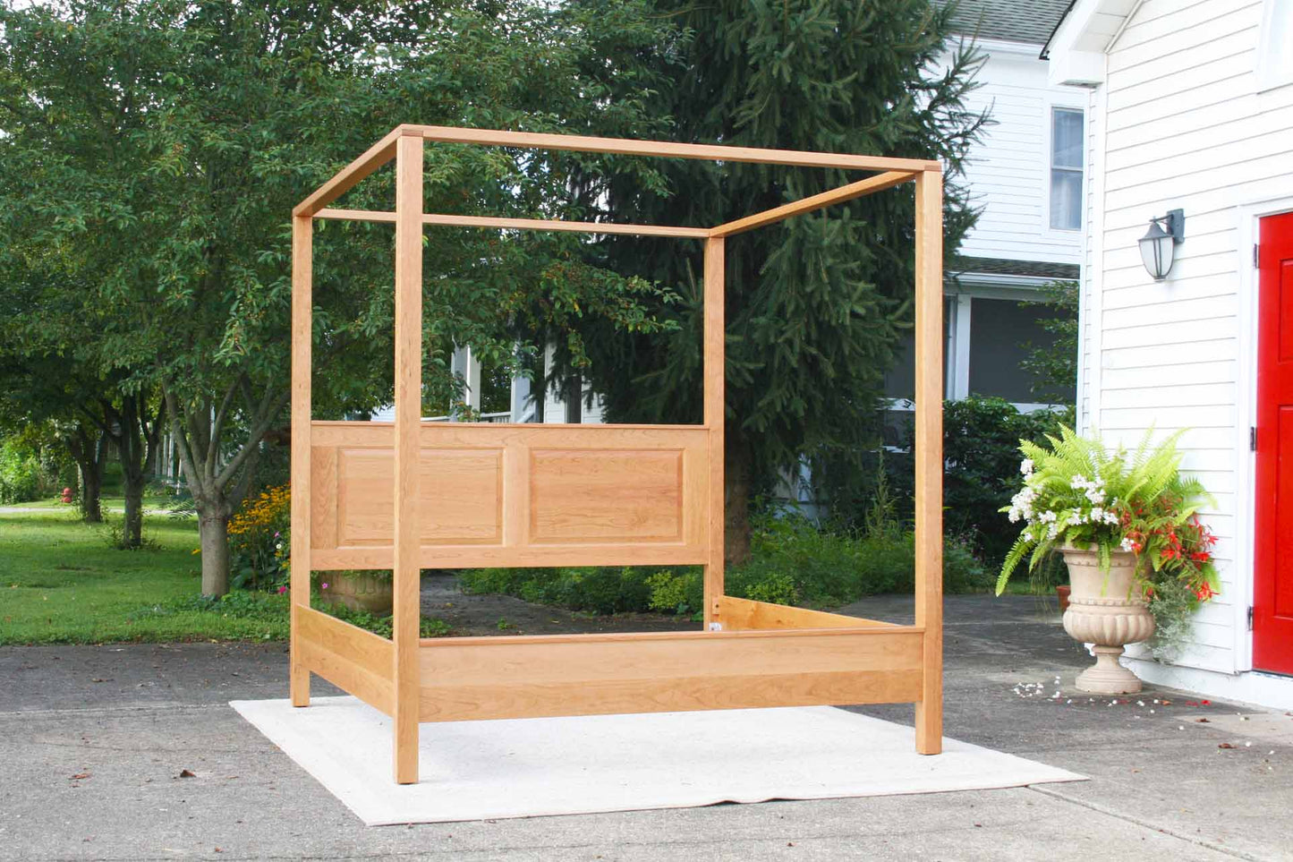 front view canopy bed with straight posts and paneled headboard