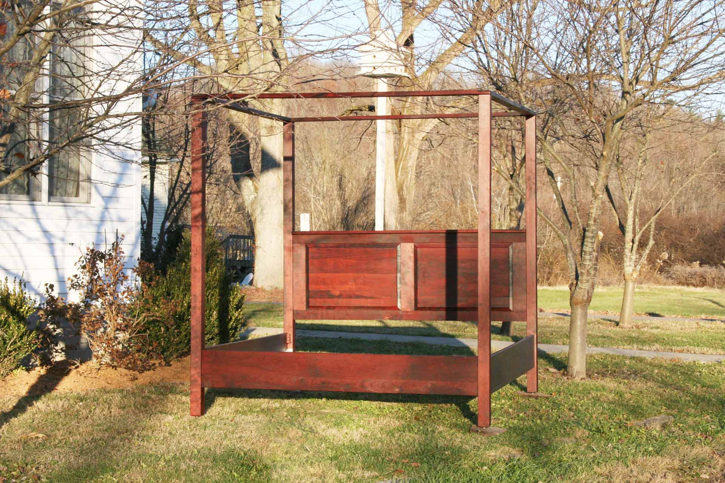 front view hardwood canopy bed with straight posts and paneled headboard