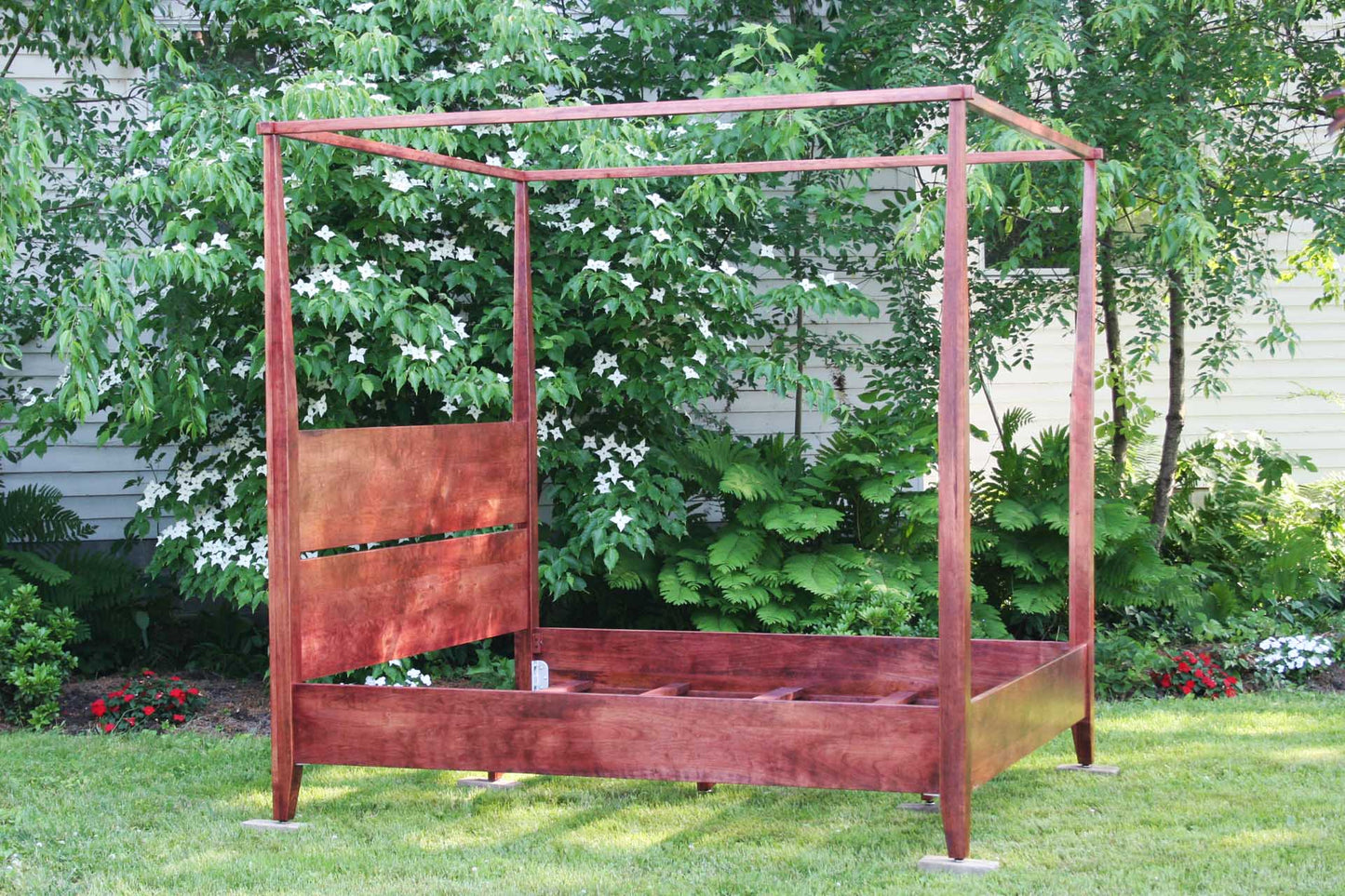 side view Solid wood canopy bed with tapered posts and headboard