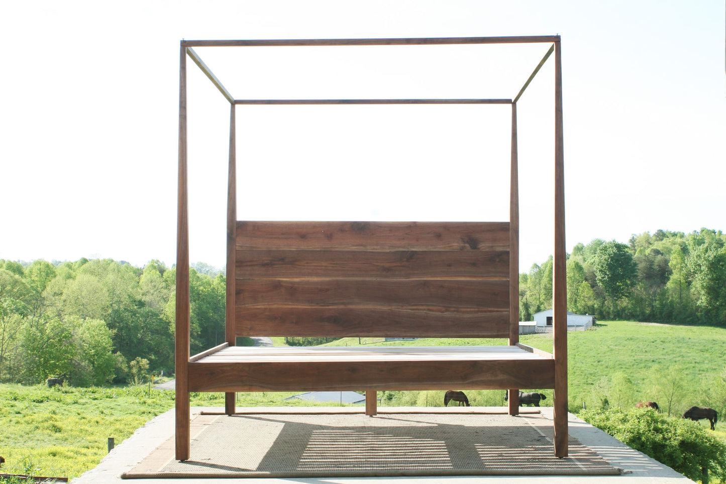 front view canopy bed with integrated headboard walnut