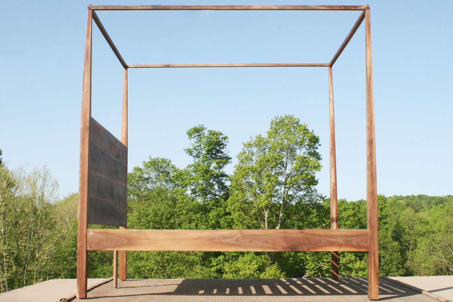 side view canopy bed with integrated headboard walnut