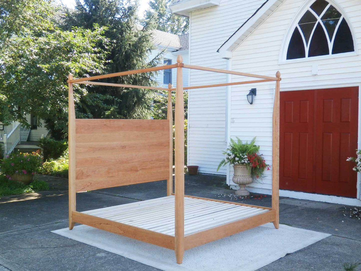 angled view Canopy Bed with a low platform