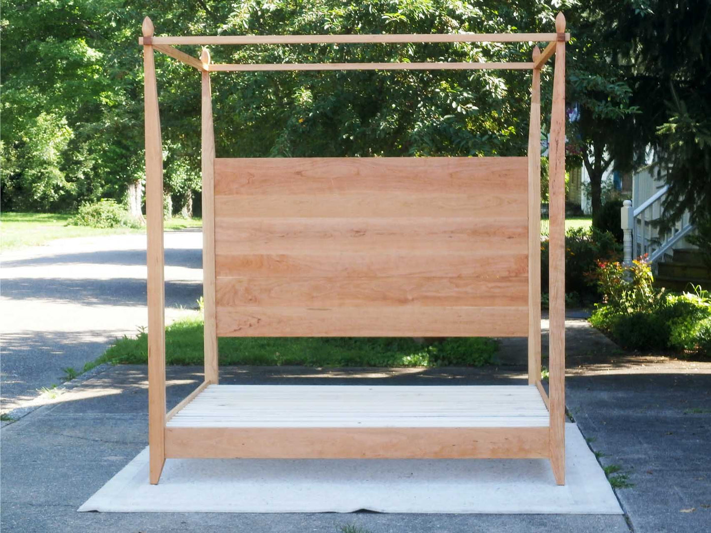 front view hardwood Canopy Bed with a low platform