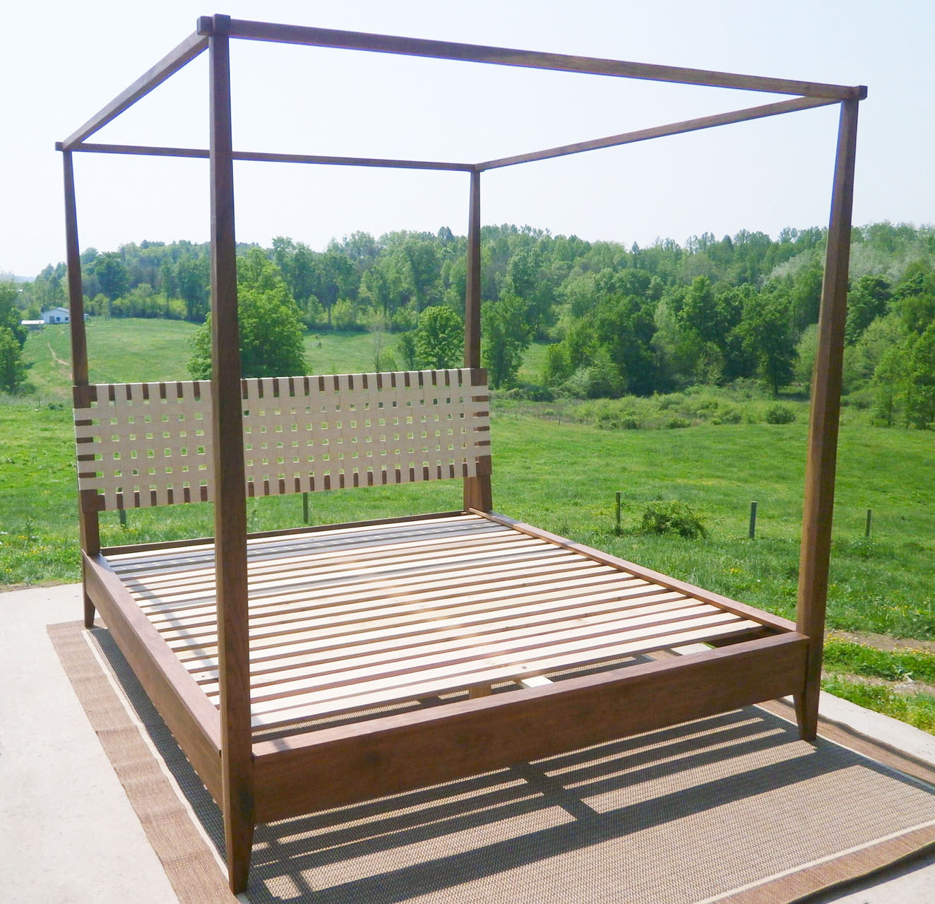 Walnut canopy bed with lattice headboard