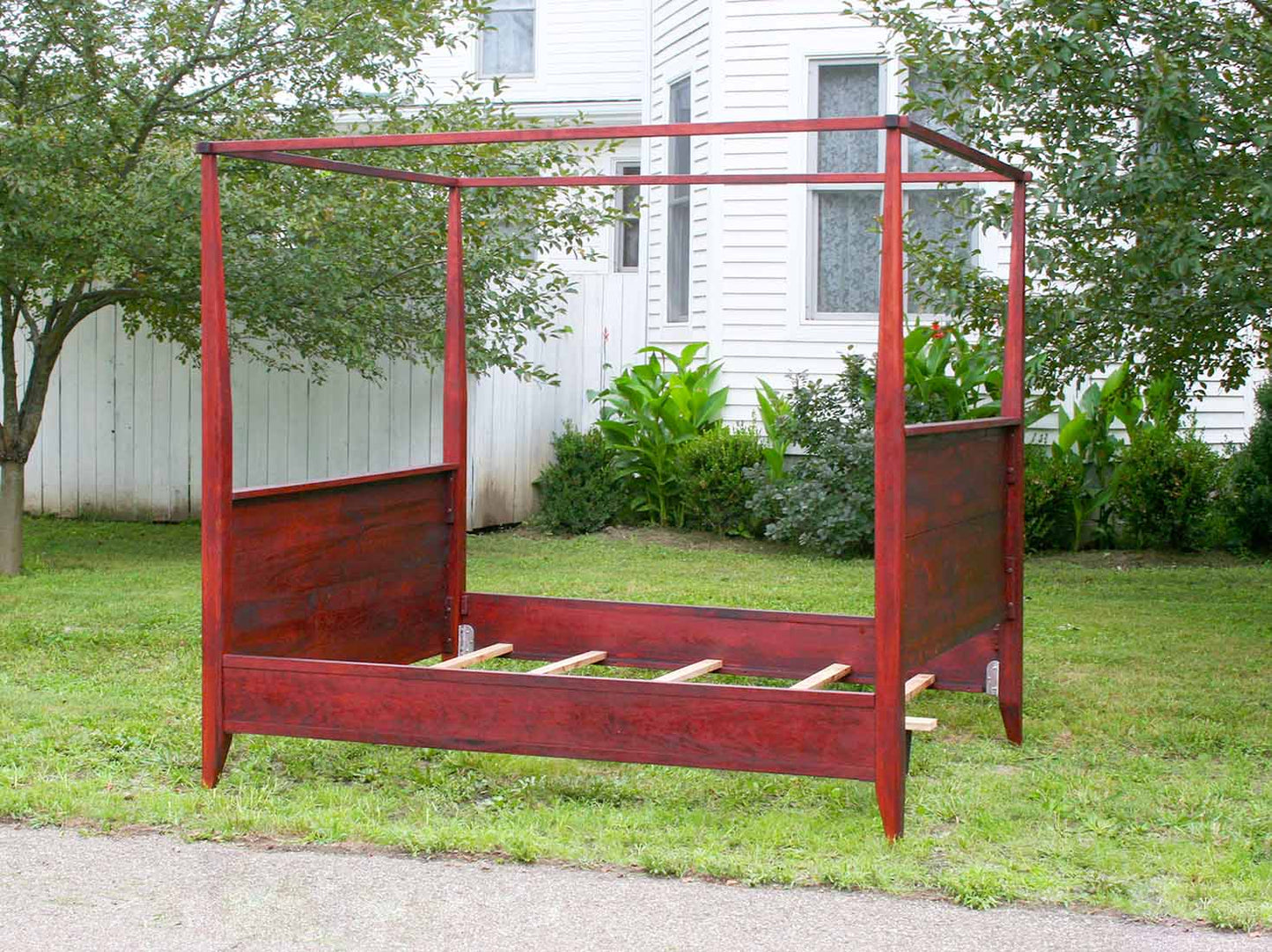 canopy bed with tall headboard and footboard back side view