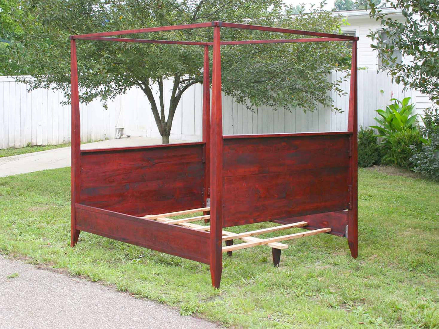 back of canopy bed with tall headboard and footboard
