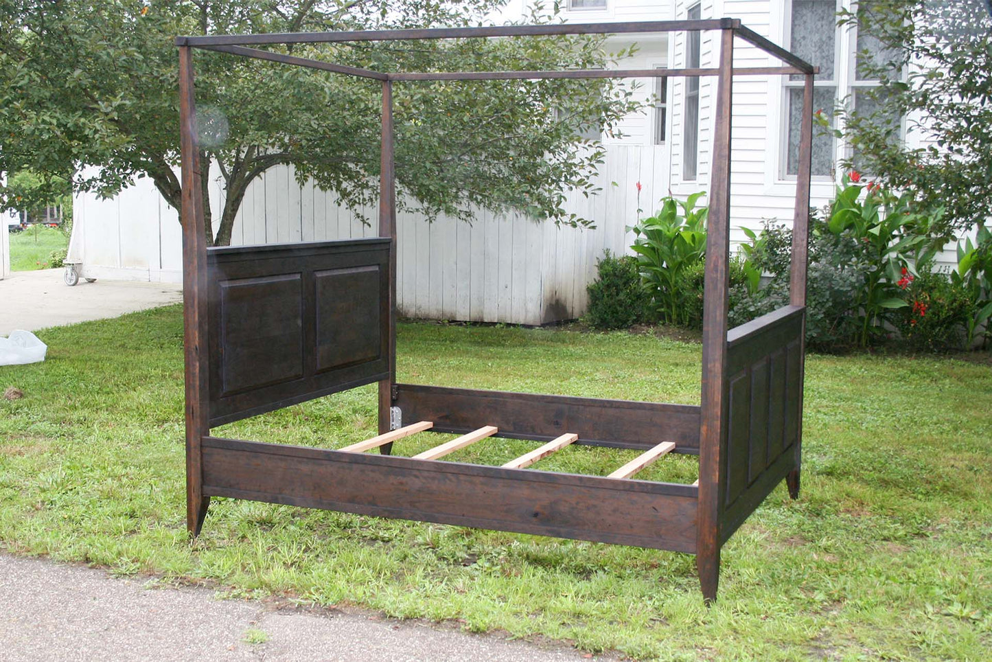 angled side view Canopy Bed with a Box Spring base
