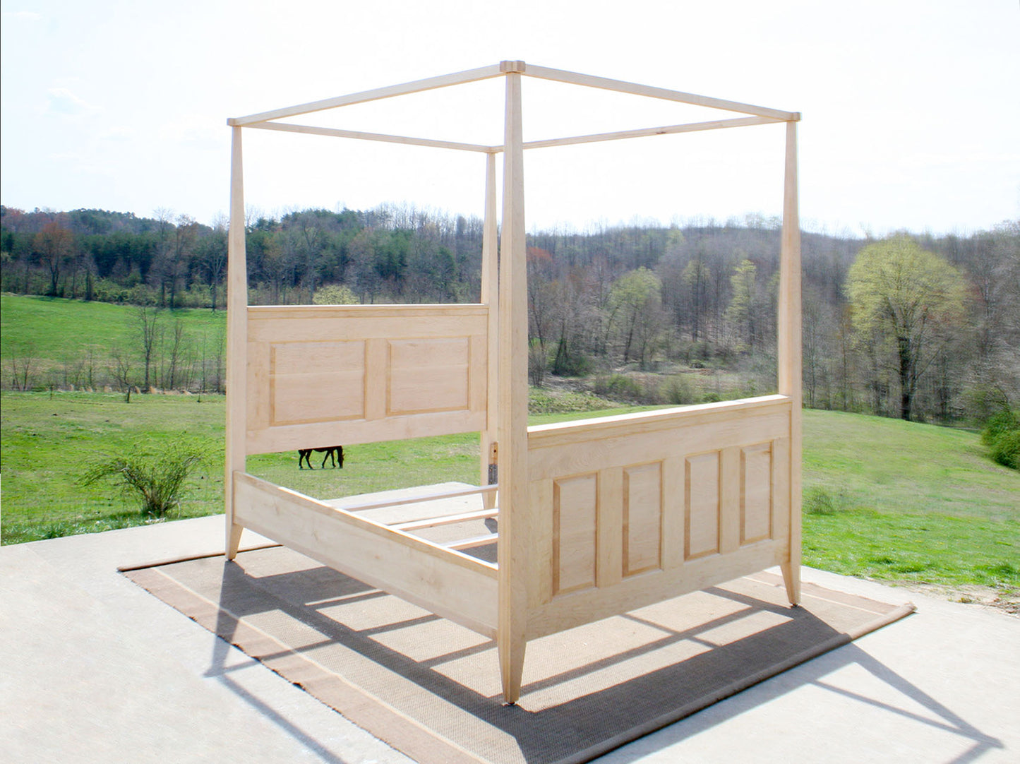 front angled view of wood Canopy Bed with panels and tapered posts