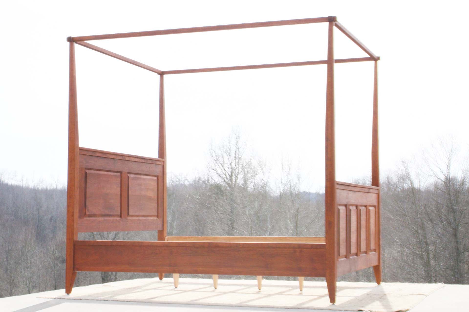 hardwood Canopy Bed with panels and tapered posts side angled view