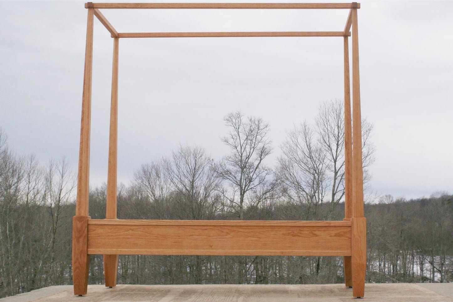 Canopy bed with tapered posts side view
