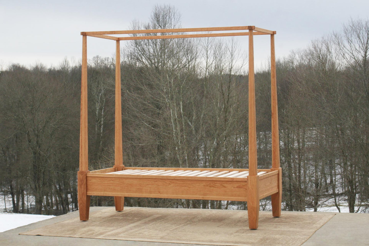 Canopy bed with tapered posts angled view
