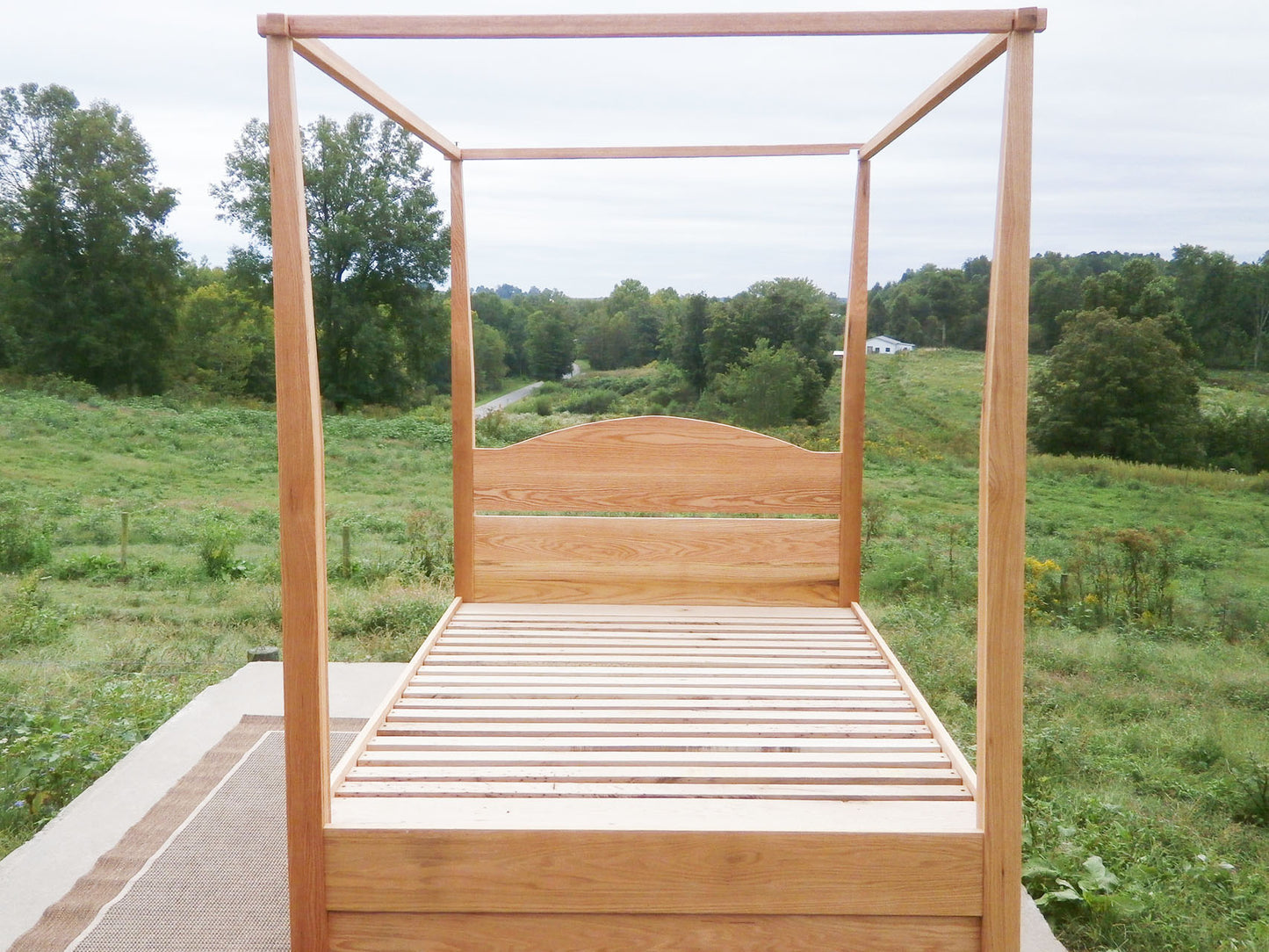 front view Canopy bed with trundle and arched headboard