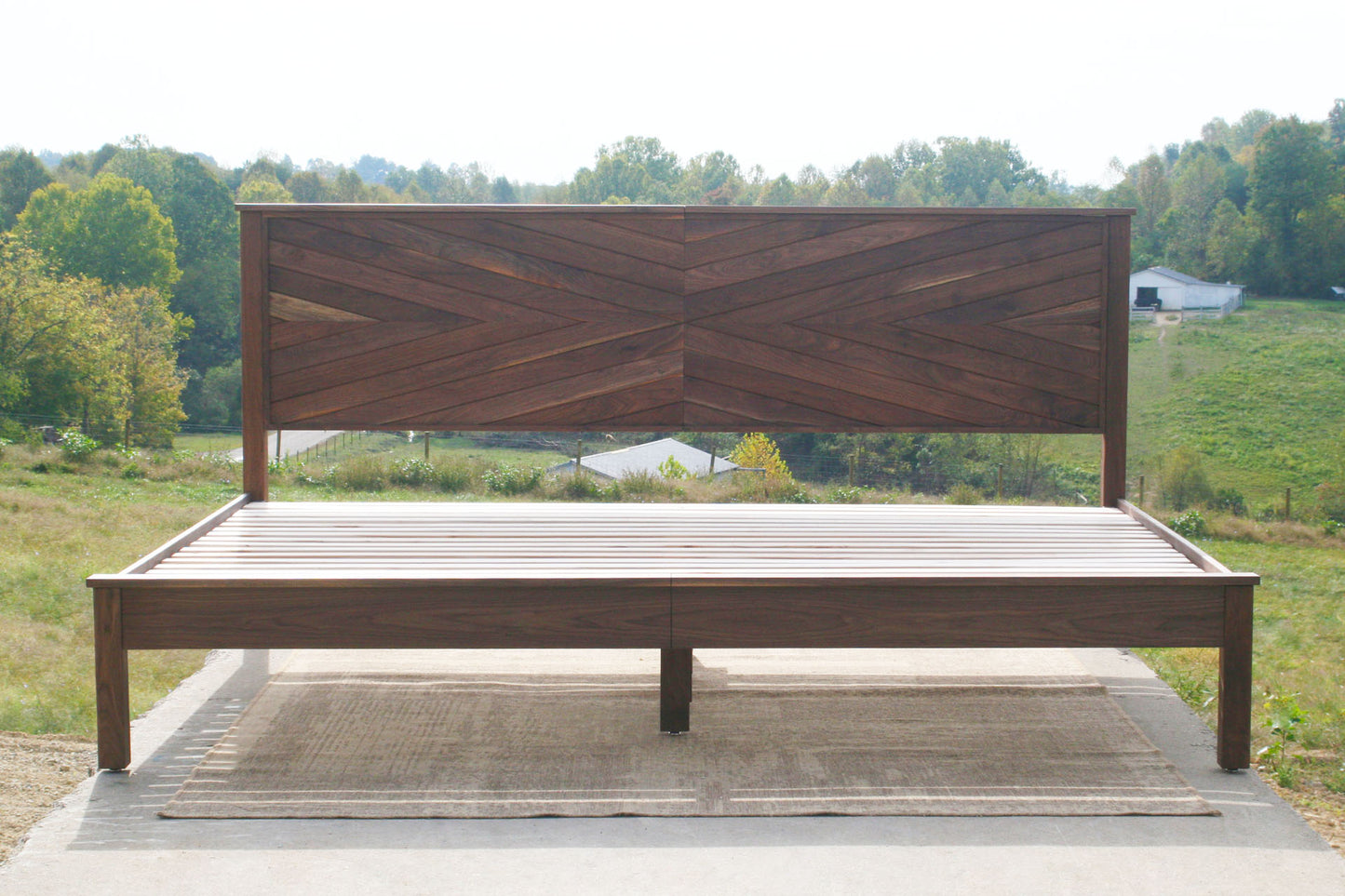 front view walnut platform bed with headboard in herringbone style