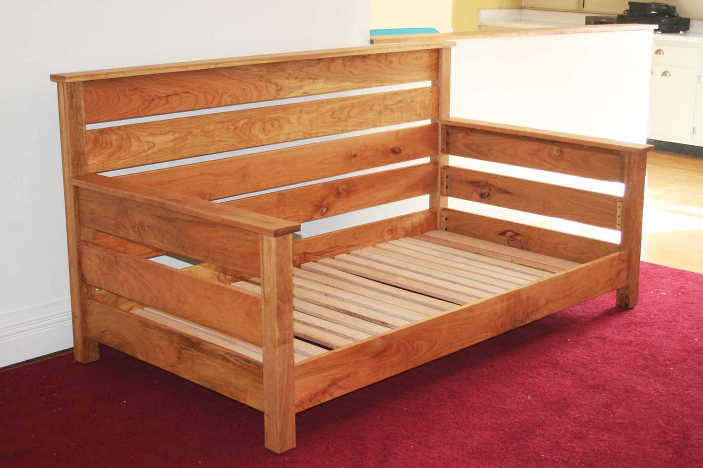 natural day bed with horizontal back and sides angled view