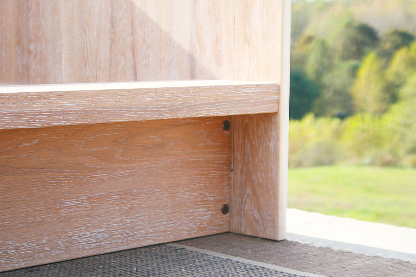 lower corner of Day Bed with a solid back and sides