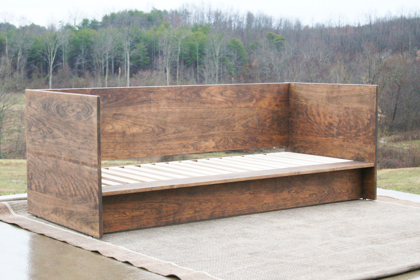 angled view natural Day Bed with a solid back and sides