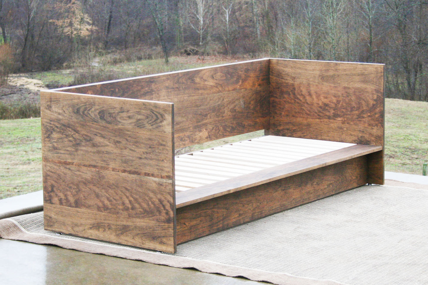 angled view natural Day Bed with a solid back and sides