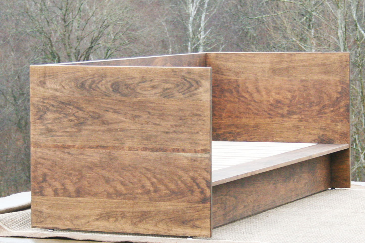 natural Day Bed with a solid back and sides side angled view