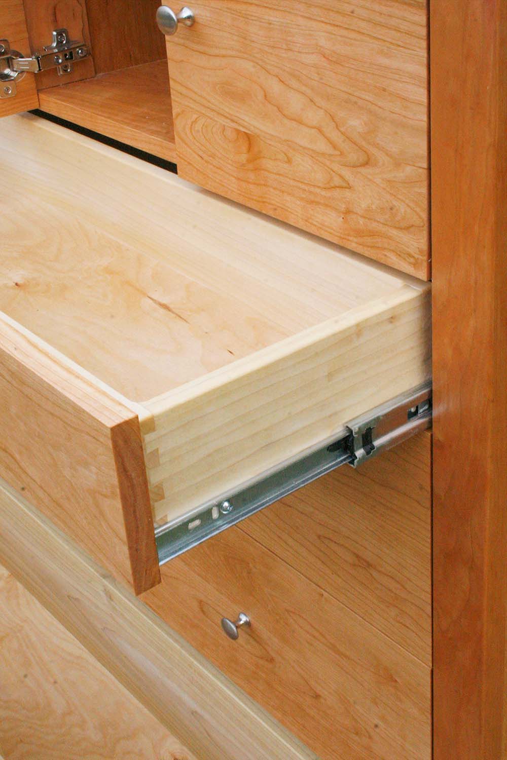 open drawer of Dresser with 4 inset drawers close up