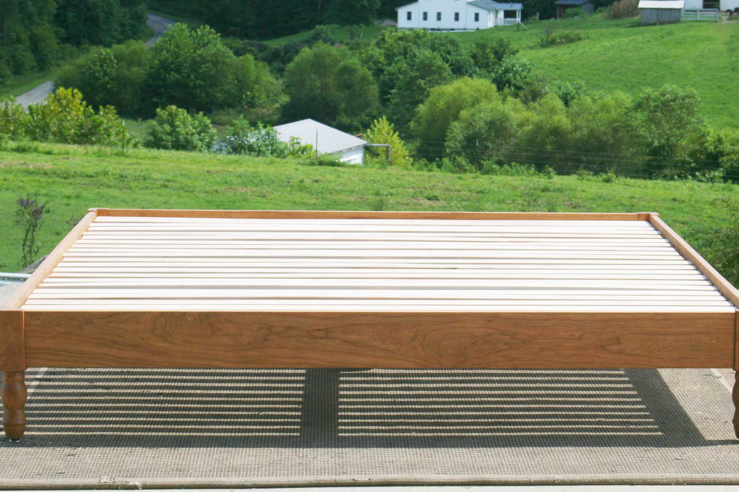 front view close up platform bed with turned corner posts