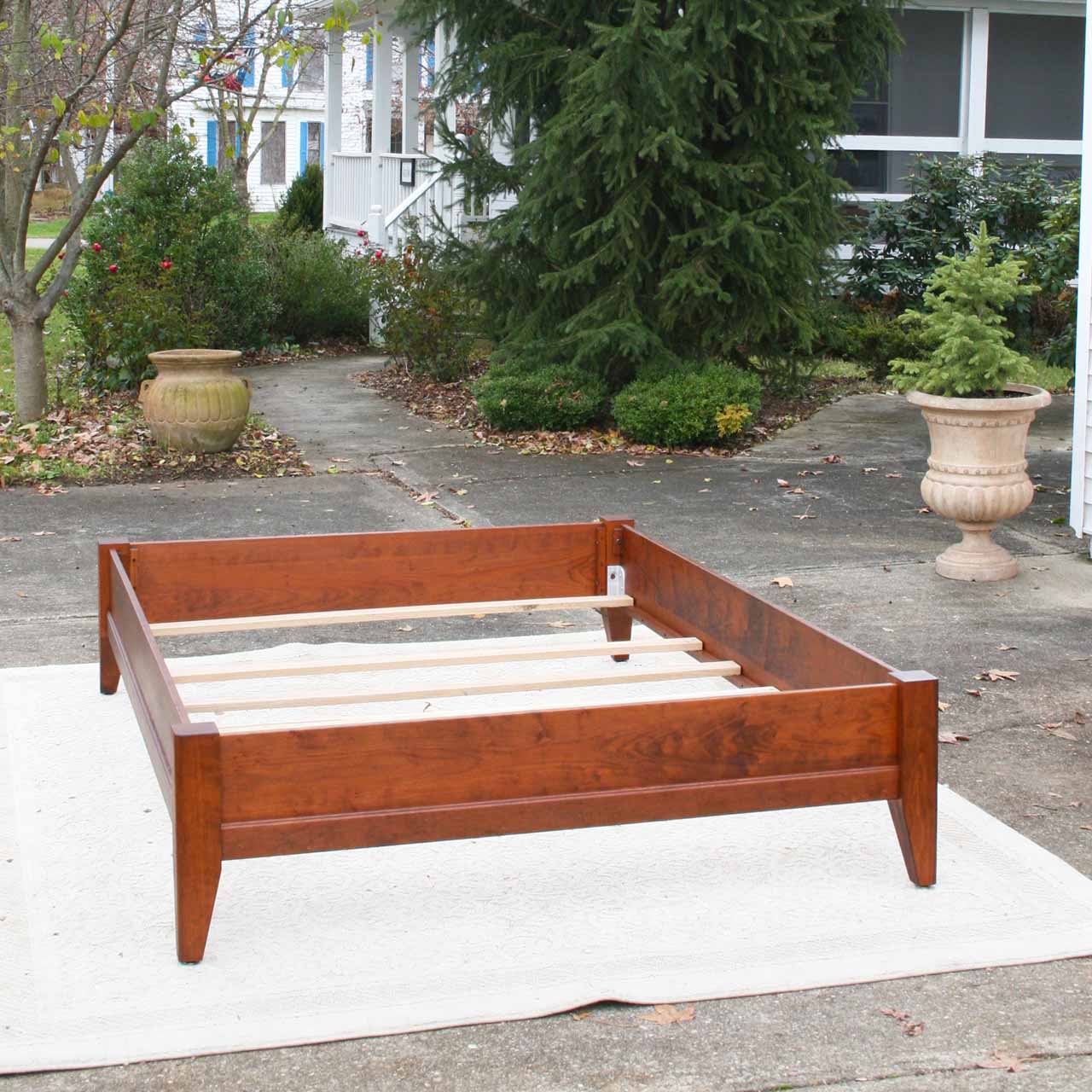 solid wood bed with trim front view