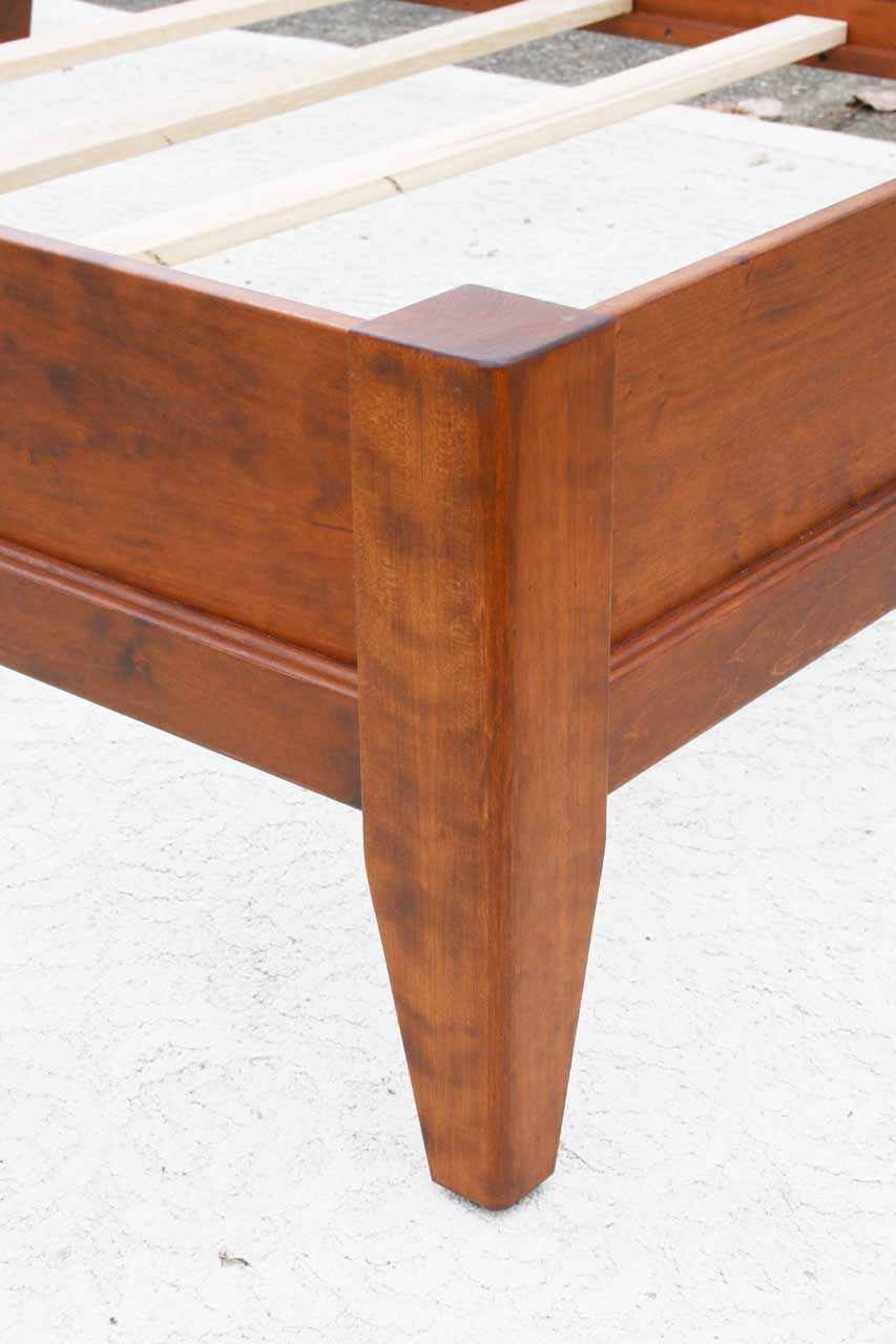 solid wood bed with trim corner view