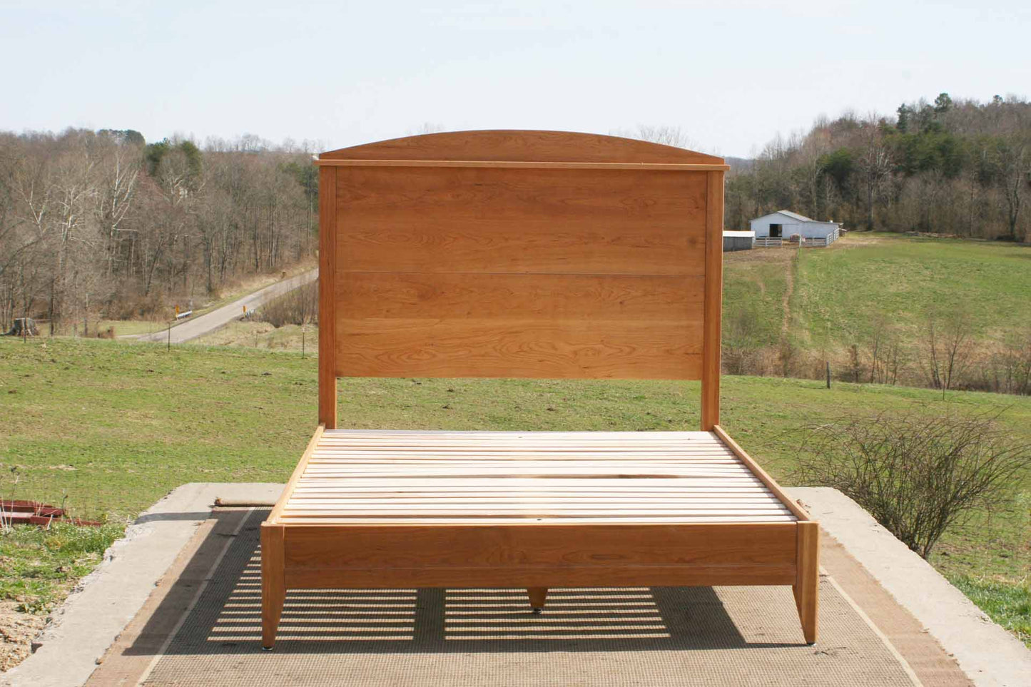 front view hardwood platform bed with tall headboard