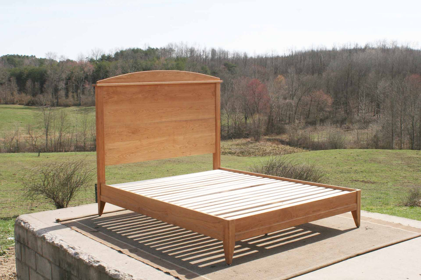 hardwood platform bed with tall headboard