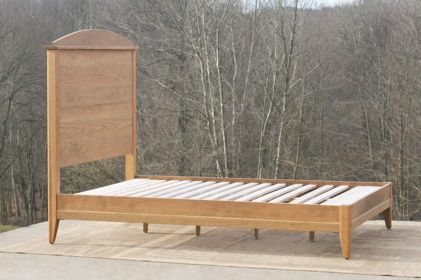 Platform bed with tall headboard angled view