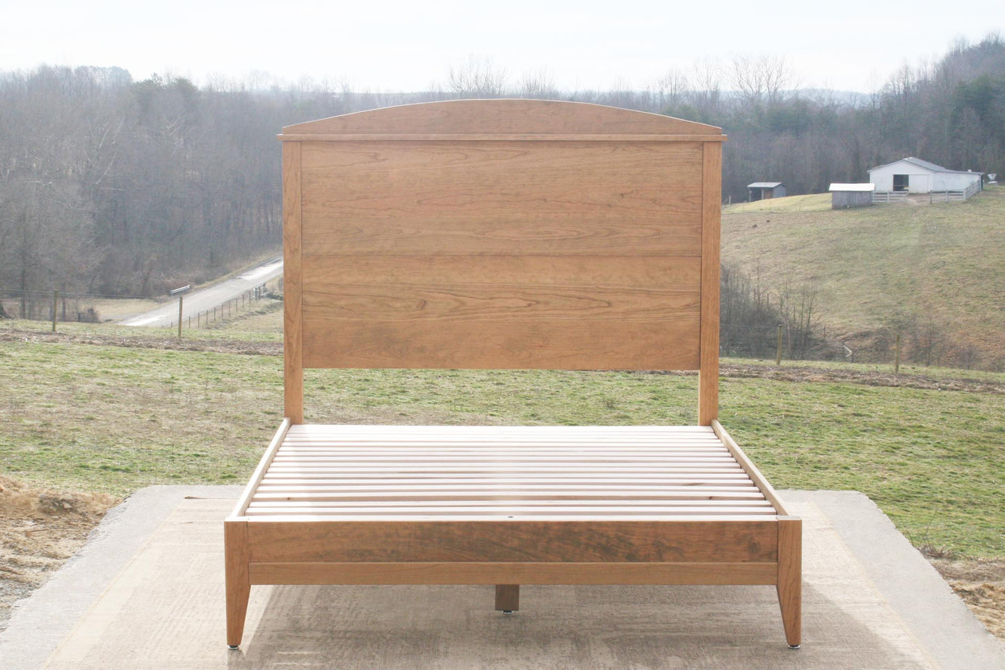 Platform bed with tall headboard front view