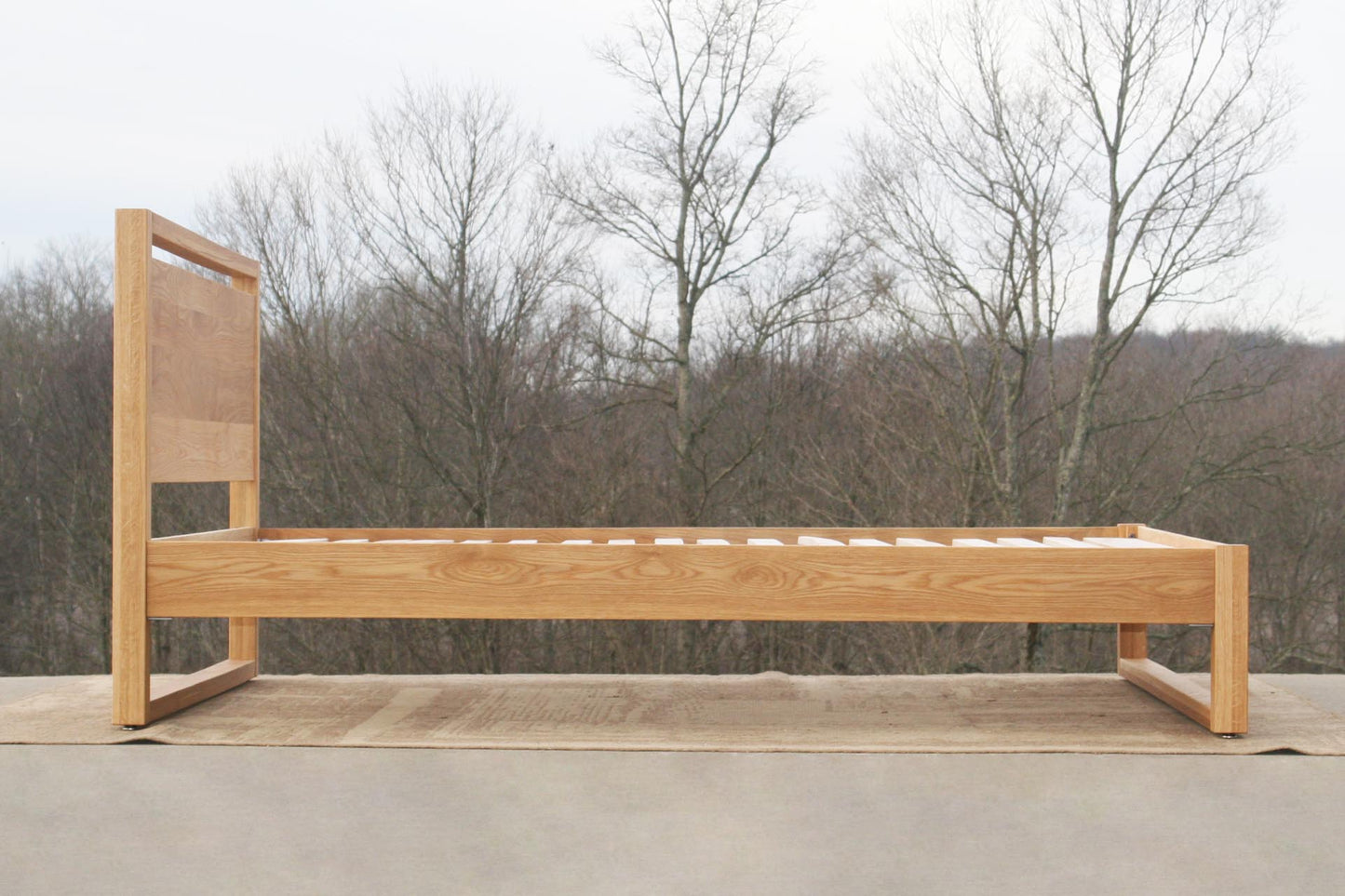 Modern platform bed with headboard side view