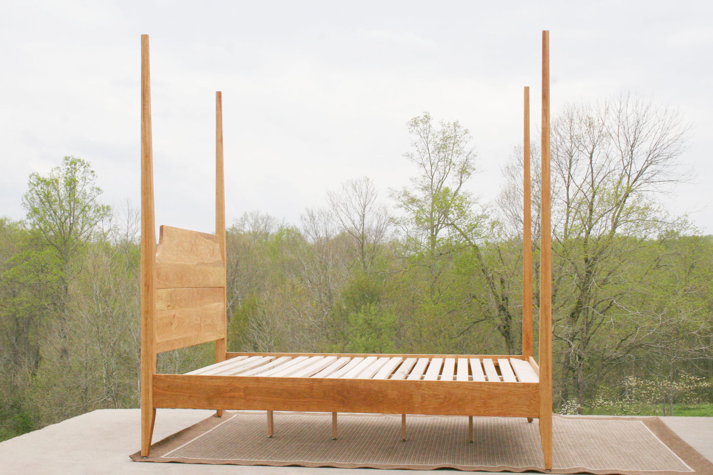 side view wood natural Four poster bed with tapered posts