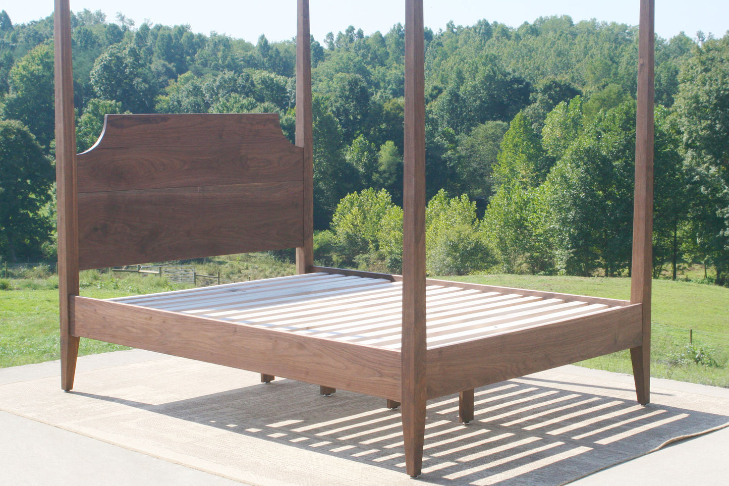 angled view of canopy bed with posts
