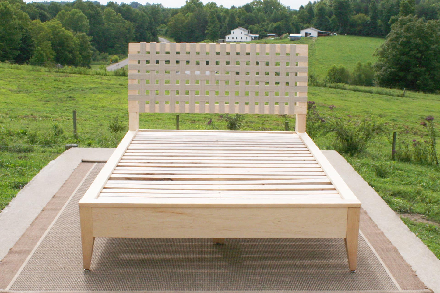 custom maple platform bed with fabric headboard front view
