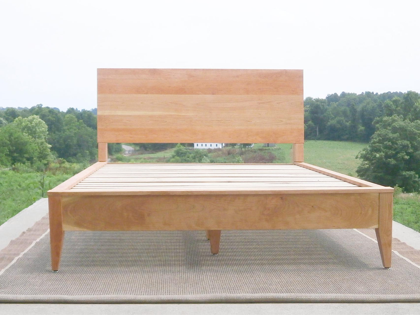 natural wood platform bed front view