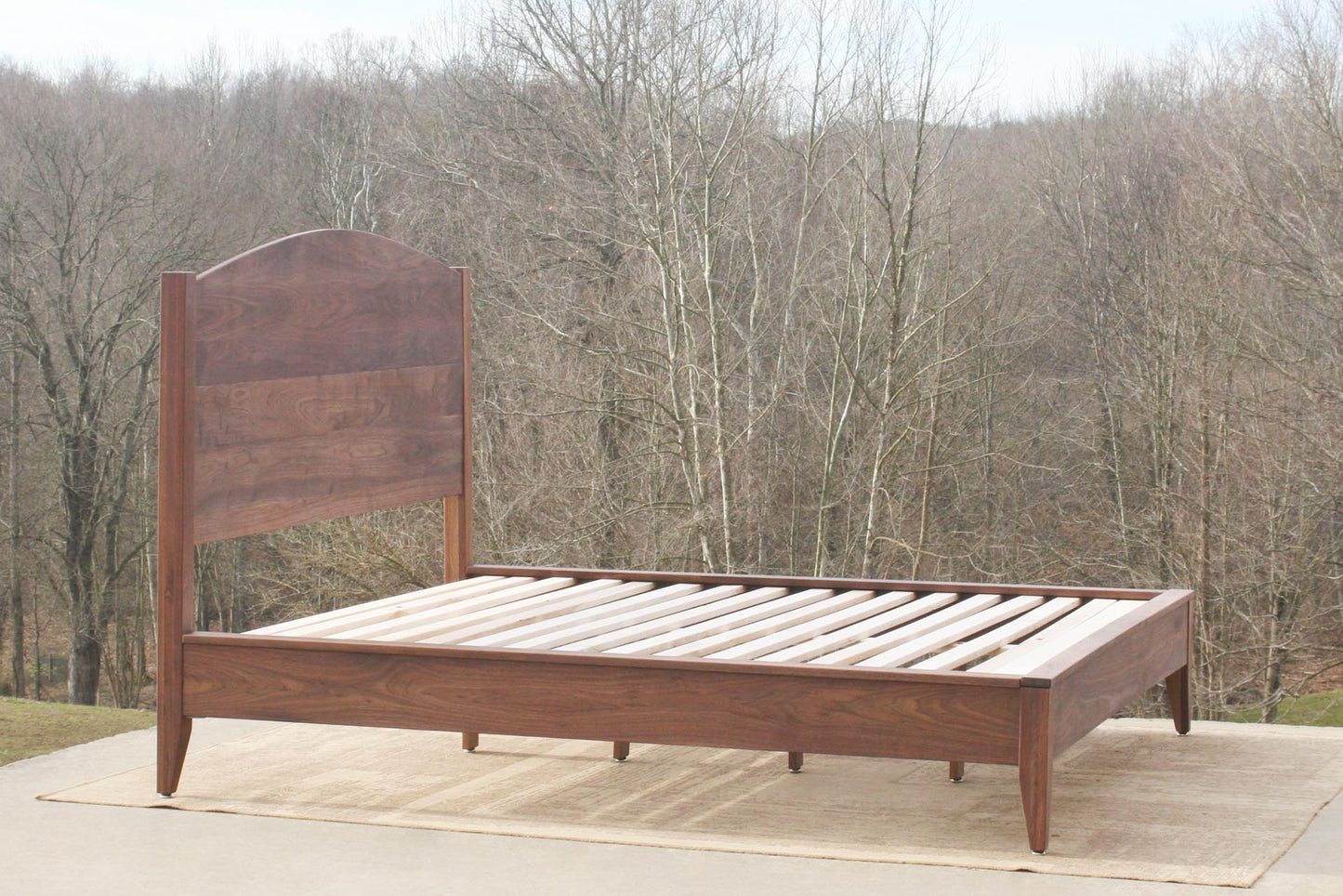 Platform bed with curved headboard