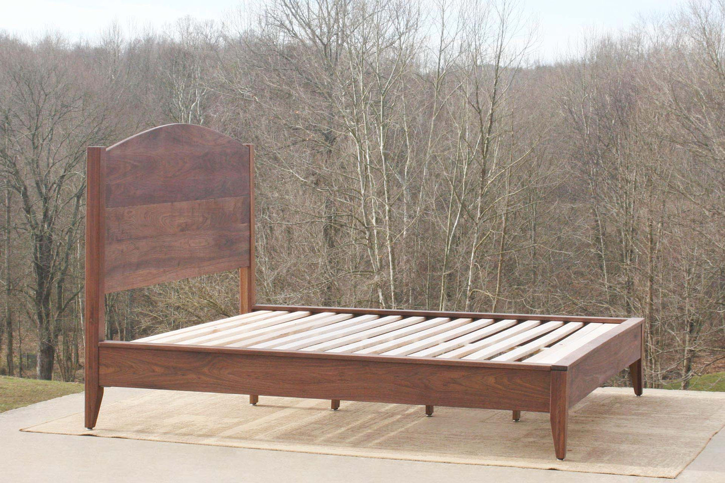 Platform bed with curved headboard