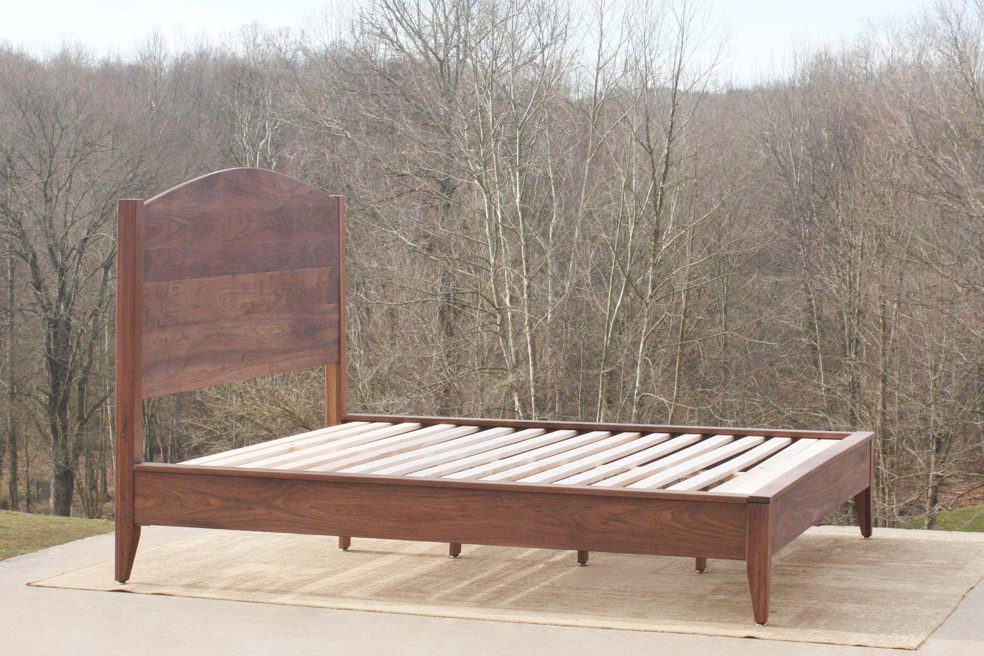 Platform bed with curved headboard