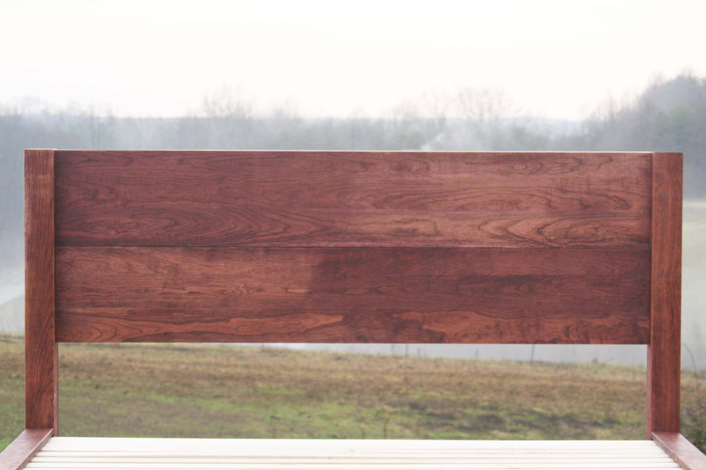 headboard of platform bed with thick posts and vertical headboard